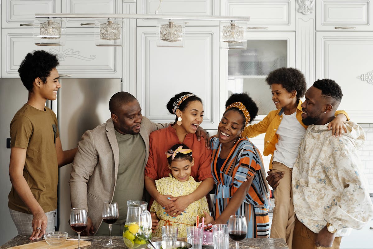 Multigenerational family gathered together in kitchen