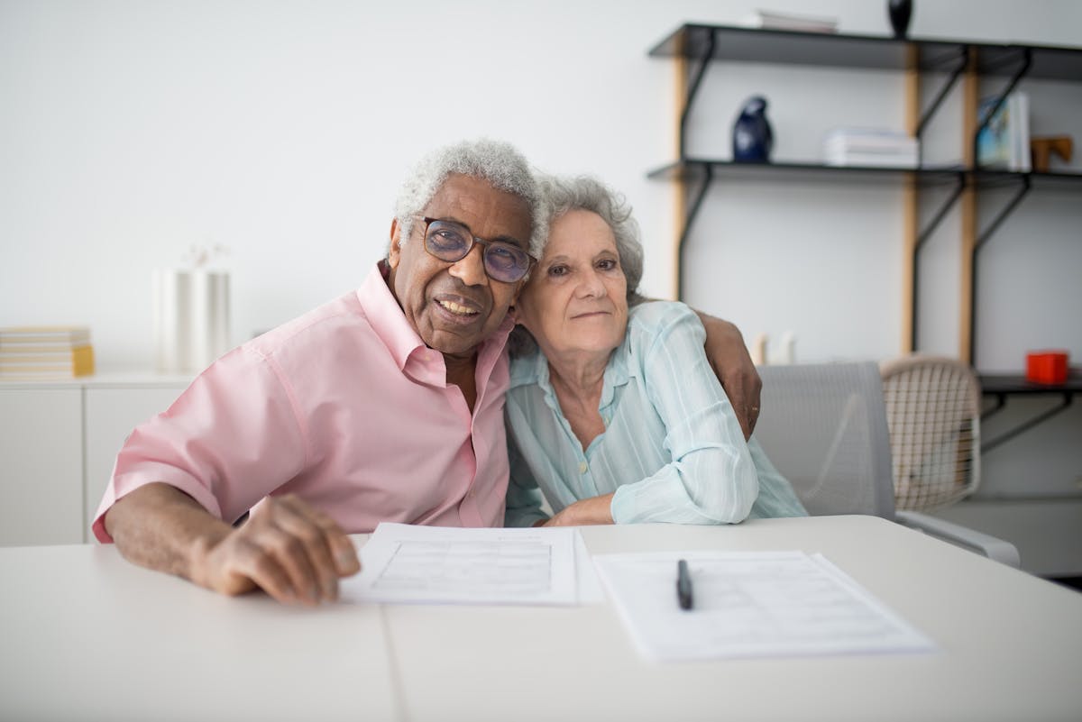 Couple reviewing documents together at home